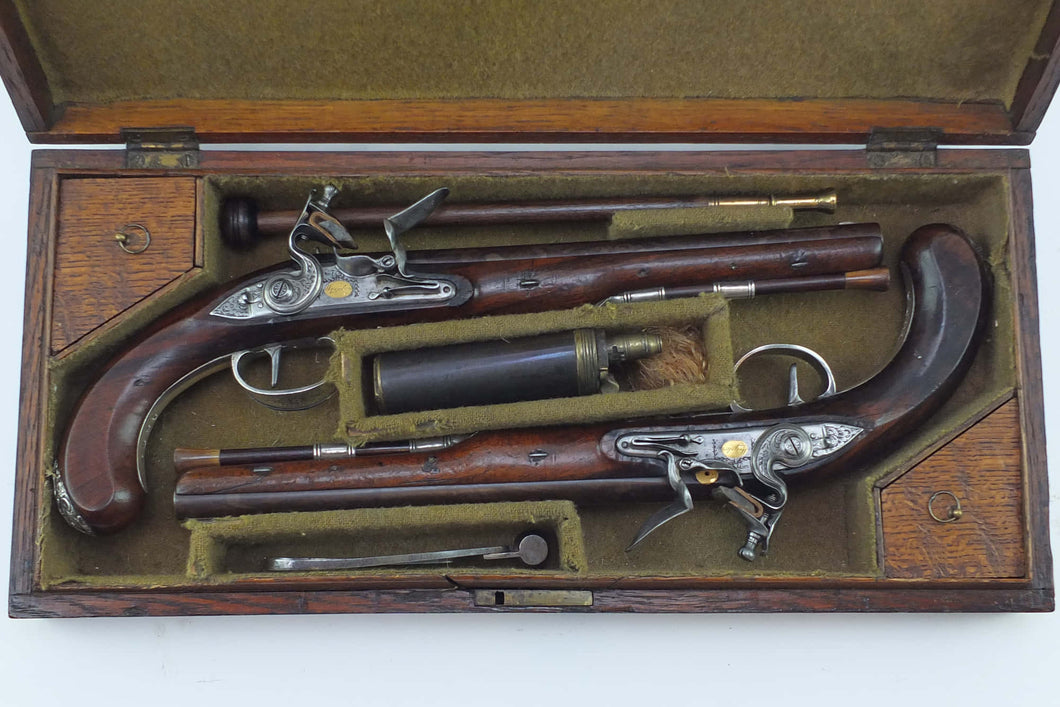 Silver Mounted Flintlock Duelling Pistols by Wogdon, Very Fine & Rare Cased Pair. SN 8832