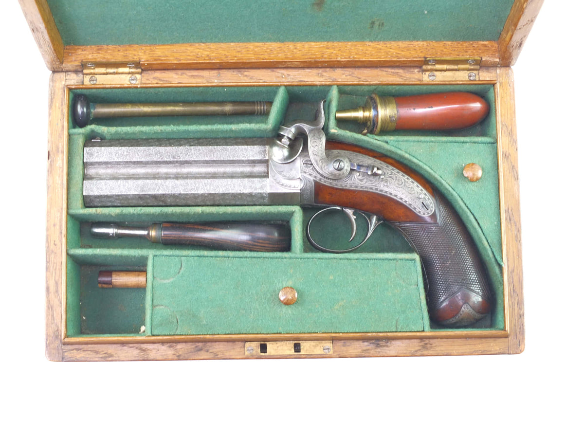 A Very Fine Cased Irish Over and Under Percussion Pistol by Trulock. S ...