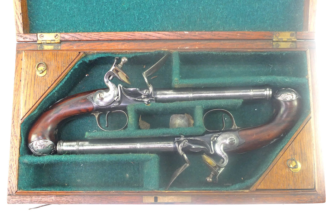 Flintlock Queen Anne Pistols by Griffin and Tow of London, a very fine cased pair. SN 8751